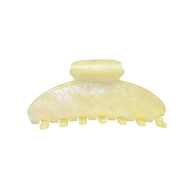 Yellow marble hair claw clip with textured surface and teeth grips for securing hair