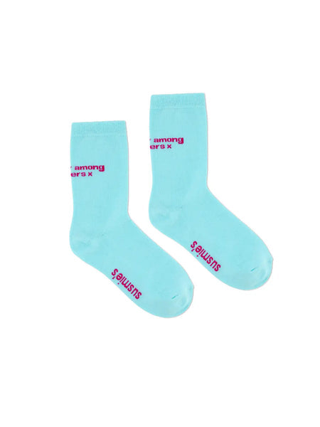 Turquoise cotton crew socks with pink text reading "among ers x" and "$OCALISTS" branding on foot