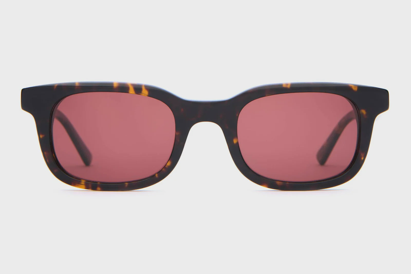 Tortoiseshell frame sunglasses with rose-tinted lenses in a classic rectangular wayfarer style