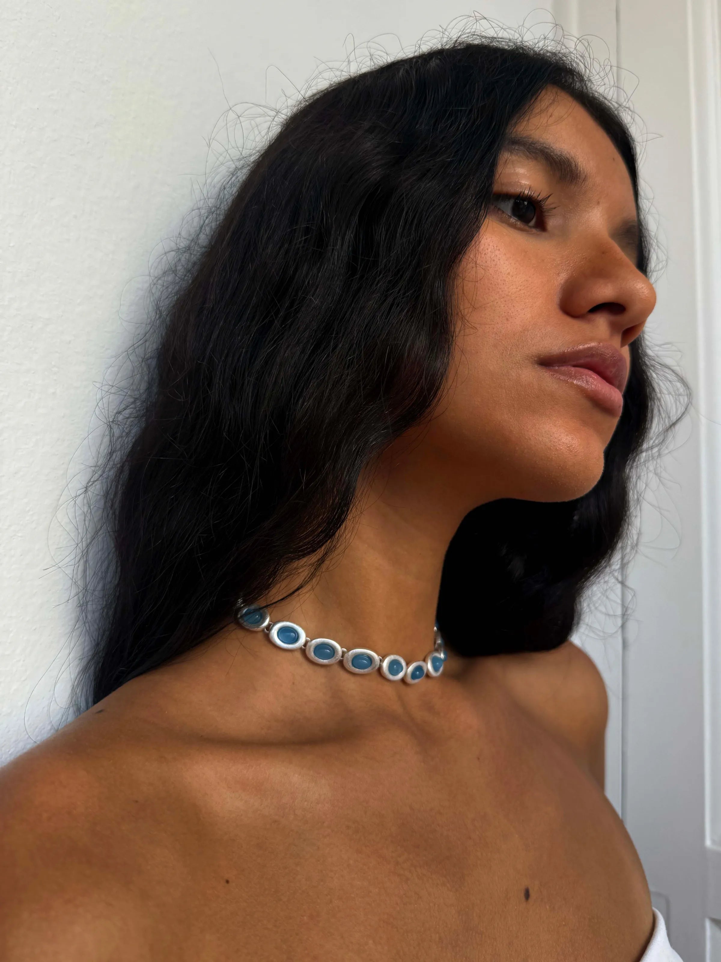 Blue kyanite gemstone choker necklace with silver-tone settings featuring oval cabochon stones in graduated sizes