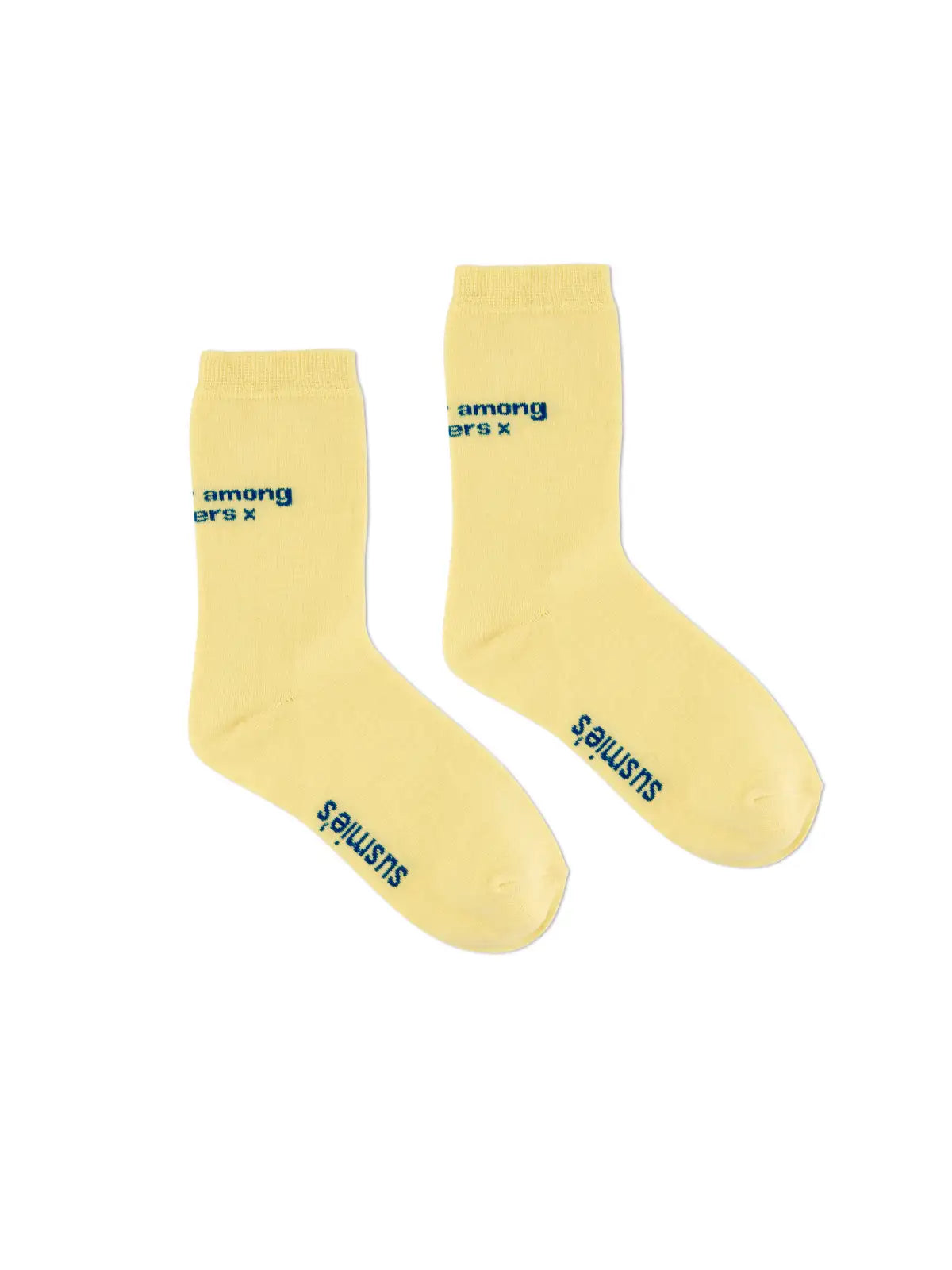 Yellow cotton crew socks with blue text reading "among others x" and "SISTERS" branding on the sole