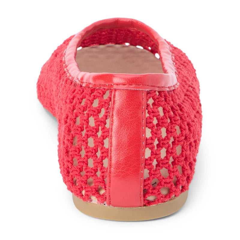 Coral pink crochet ballet flat shoe with leather trim, shown from back heel view on white background