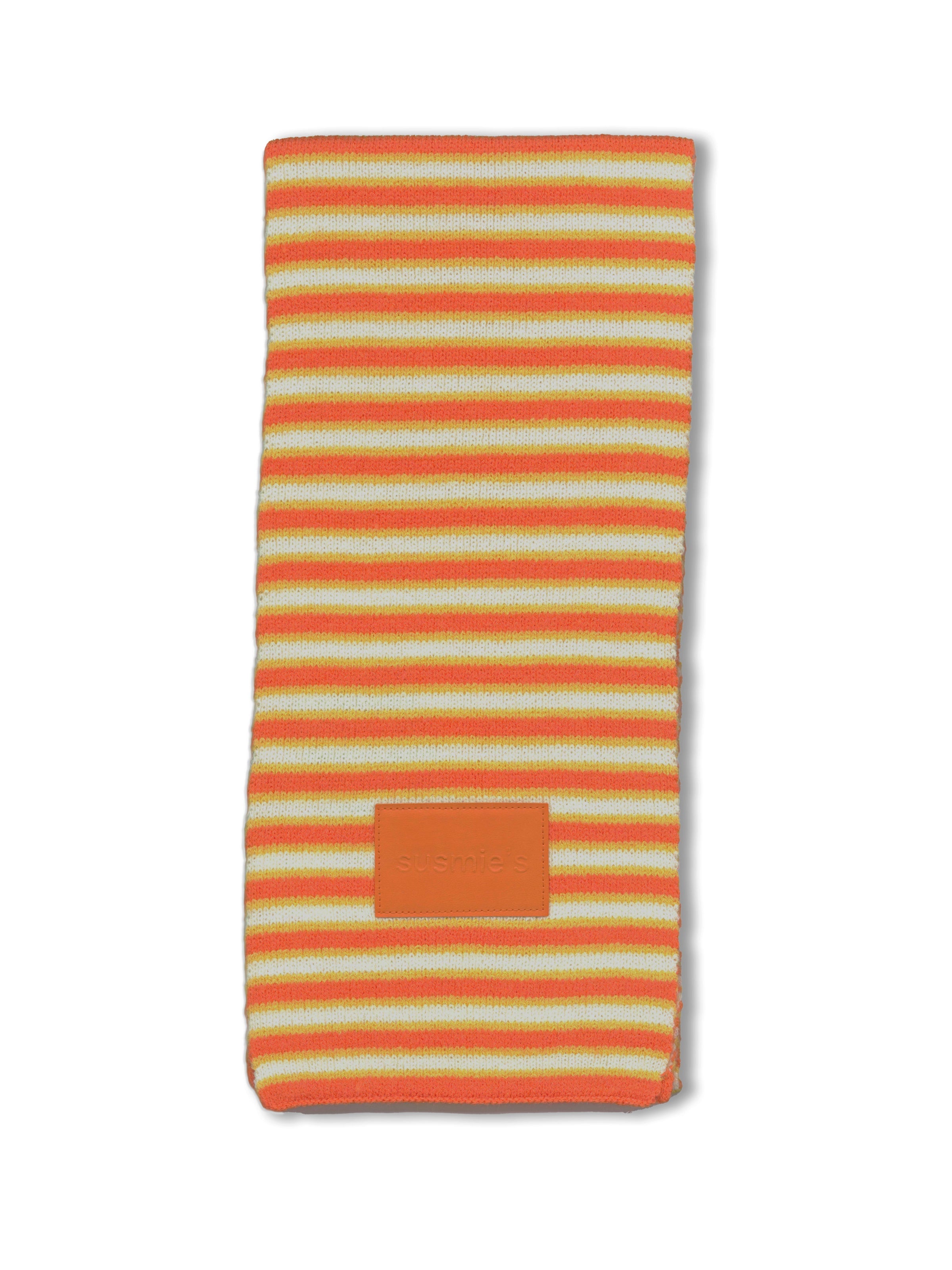Orange and yellow striped knit phone case with leather patch detail