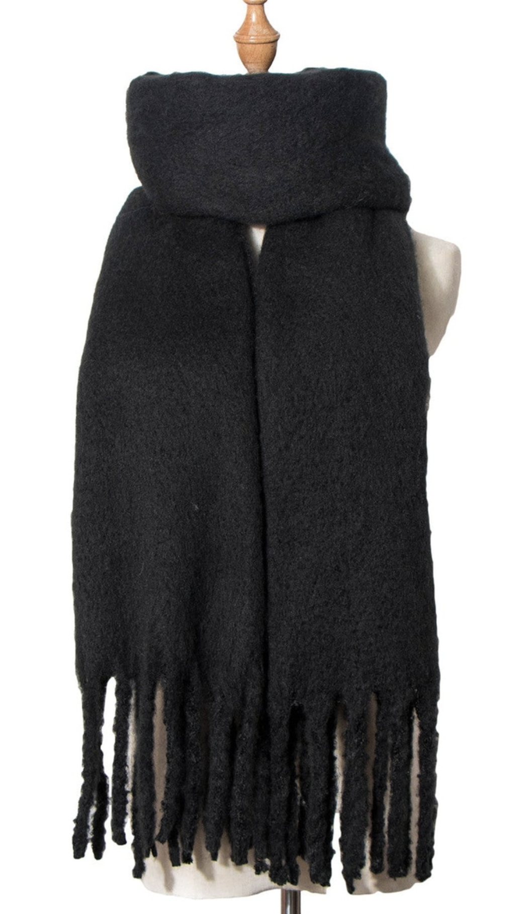 Black knit scarf with fringe tassels displayed on mannequin bust with wooden stand
