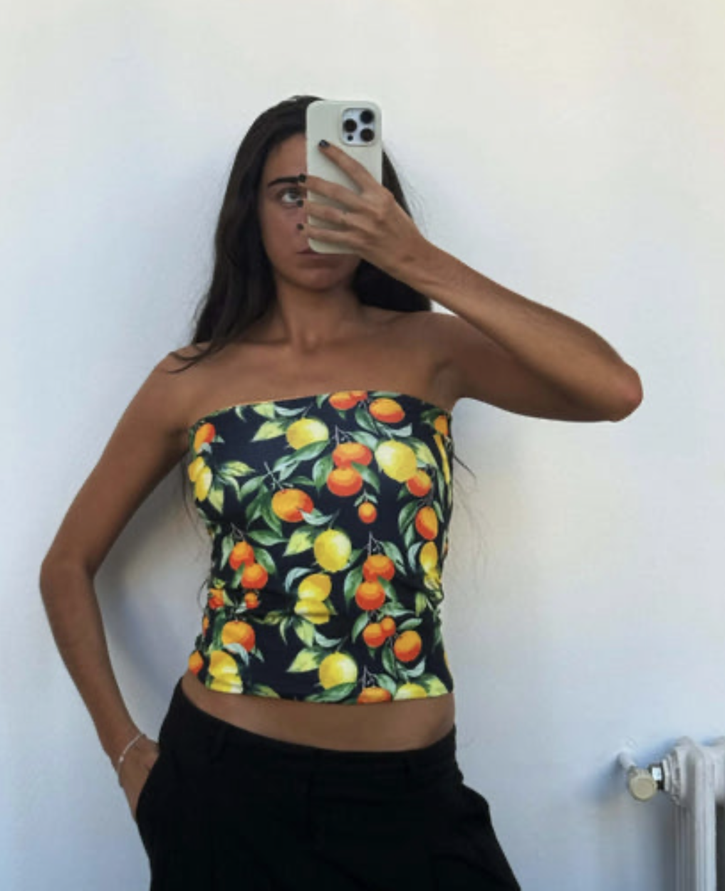 Black strapless tube top with colorful citrus fruit print featuring lemons and oranges with green leaves