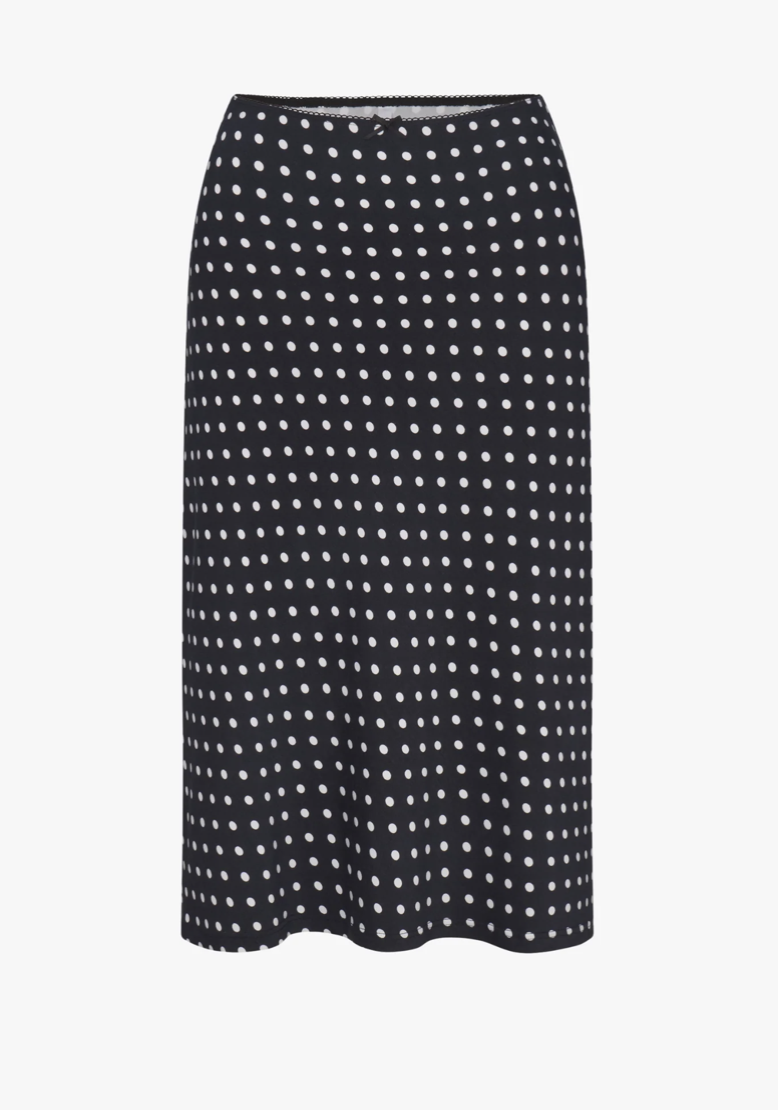 Black midi skirt with white polka dot pattern and elasticated waistband