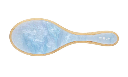 Light blue jade facial massage tool with natural wood trim and EMI JAY branding on handle