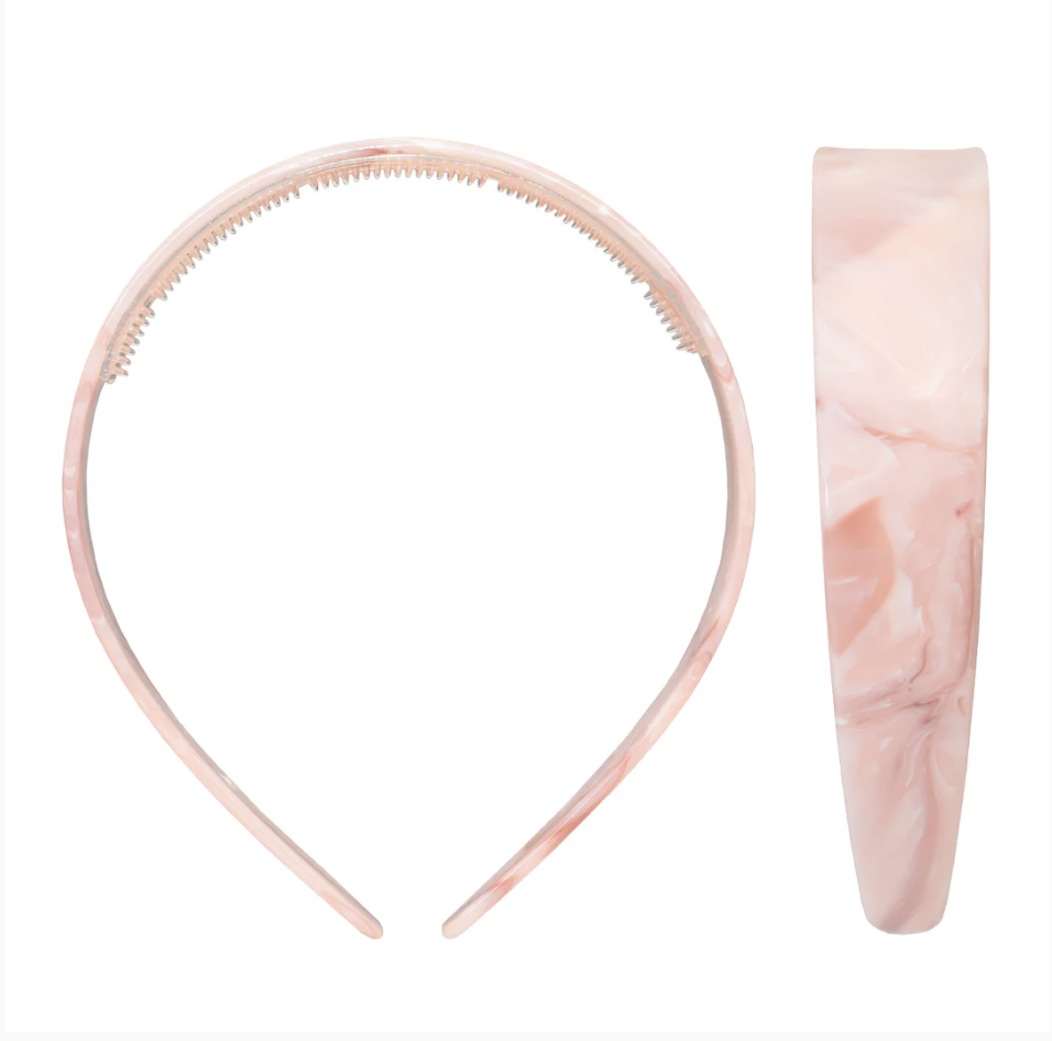 Pink marbled acrylic headband with toothed grip and wide smooth band, shown from front and side view