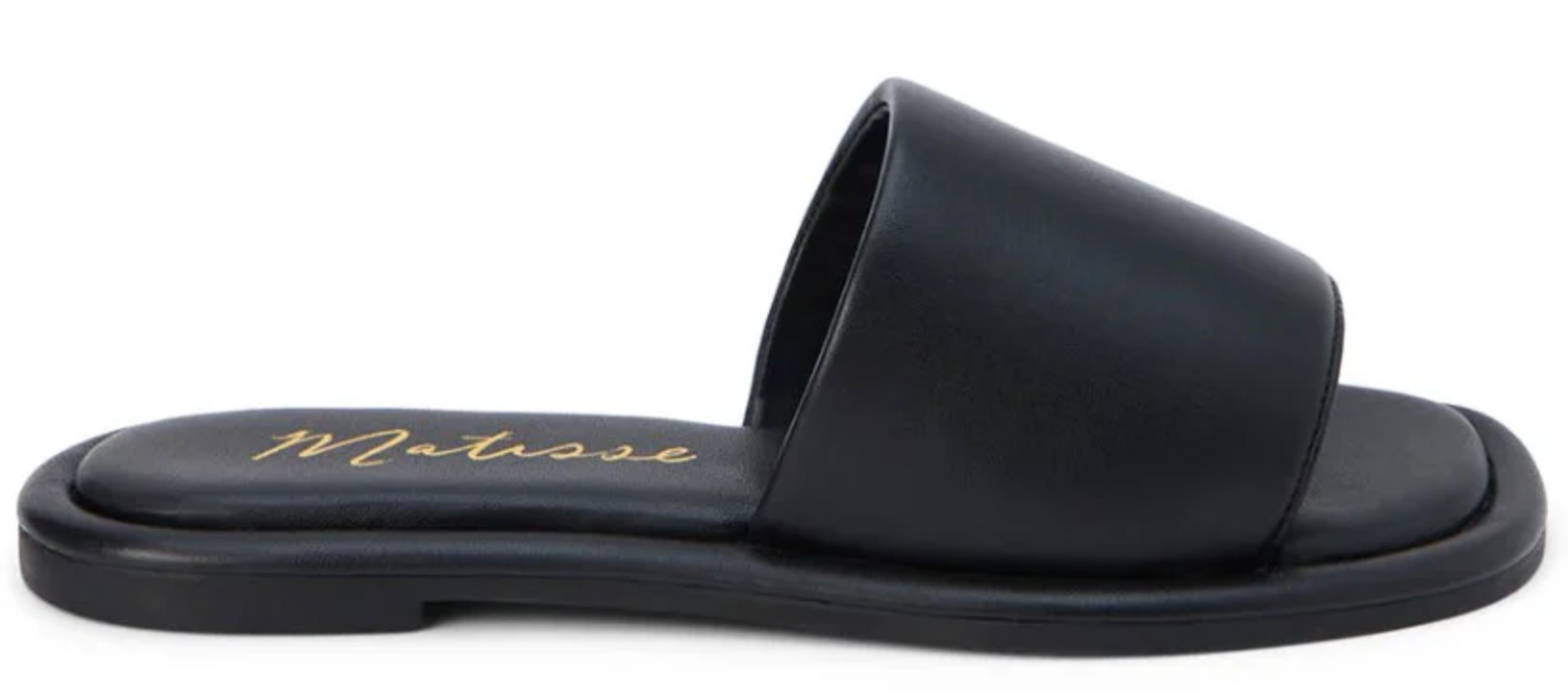 Black leather slide sandal with padded strap and Matisse gold script logo on footbed, side view