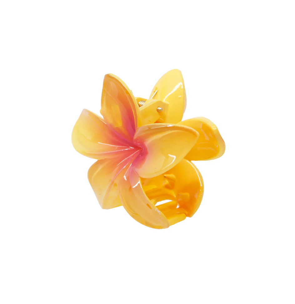 Yellow and orange resin plumeria flower hair claw clip with glossy finish and tropical design