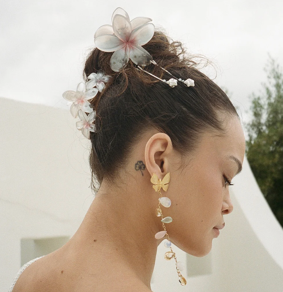 Long dangling butterfly earrings with iridescent shell discs and gold-tone metal chain in pastel pink and cream tones