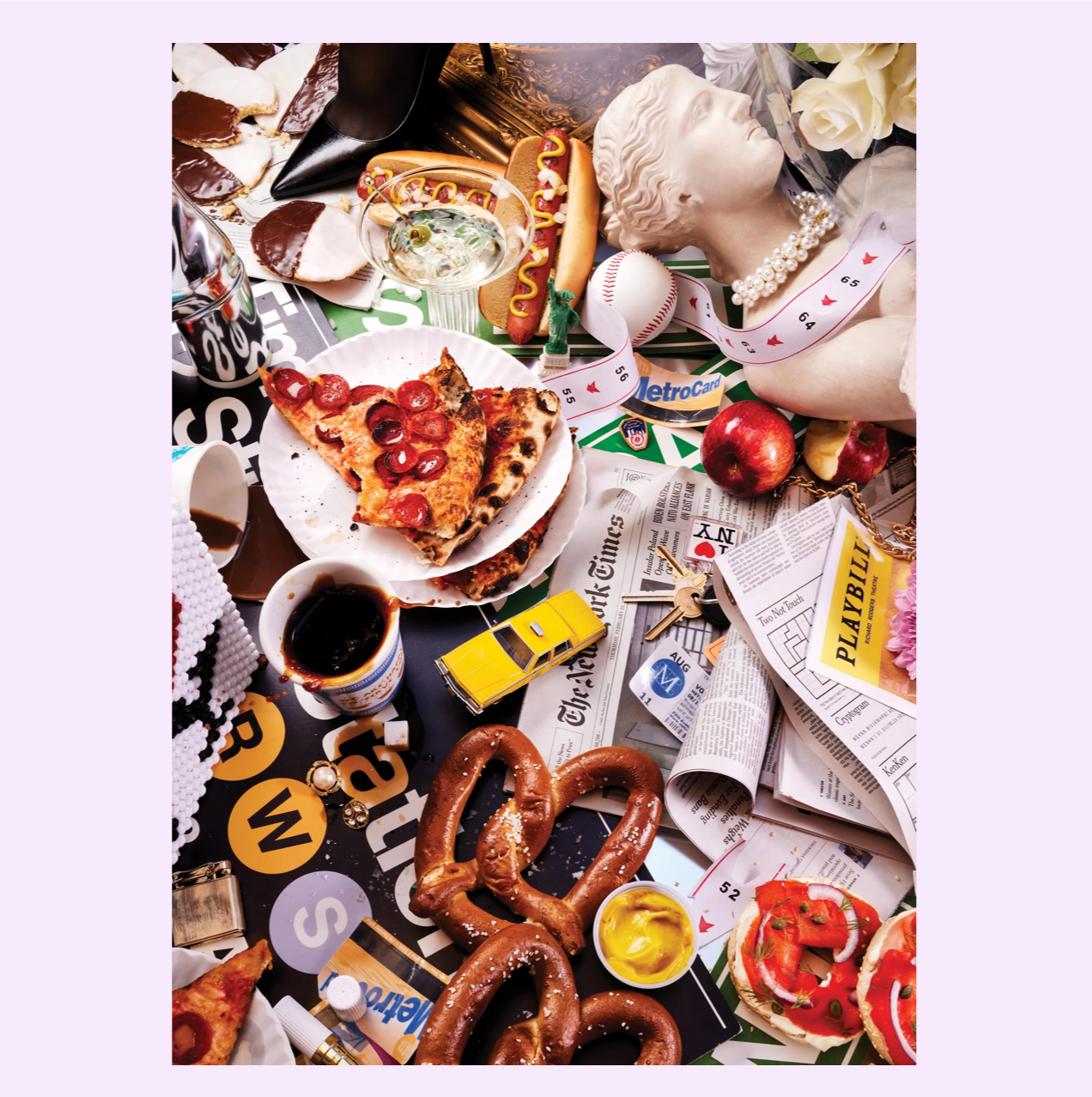 Overhead flat lay of eclectic items including pepperoni pizza, pretzels, baseball, newspapers, vintage bust sculpture, and yellow toy car