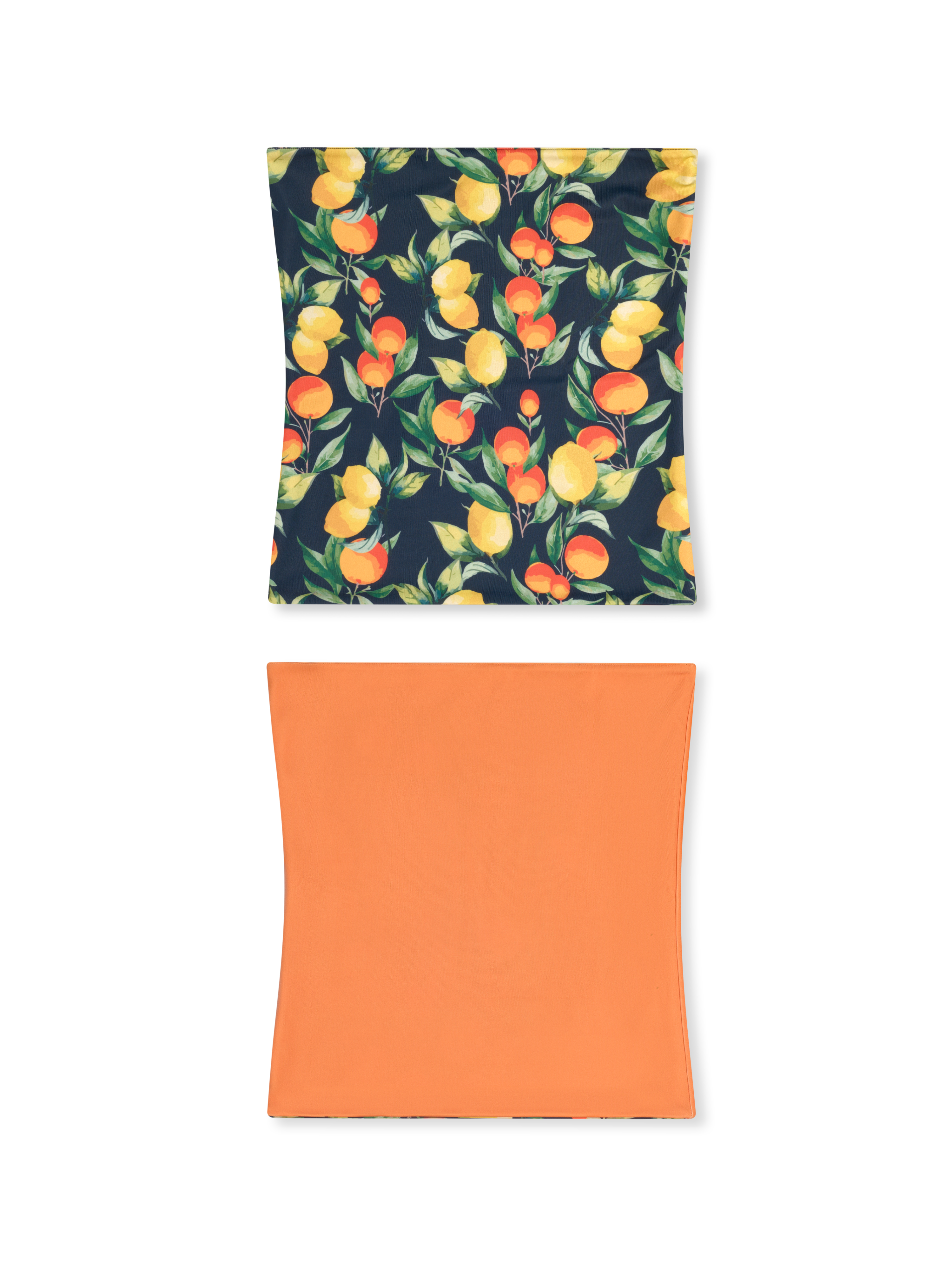 Reversible neck gaiter with citrus fruit pattern on dark background and solid coral orange reverse side