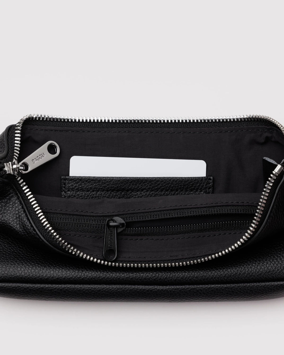 Black leather wallet with zipper partially open showing interior pockets and card slots with white card inserted