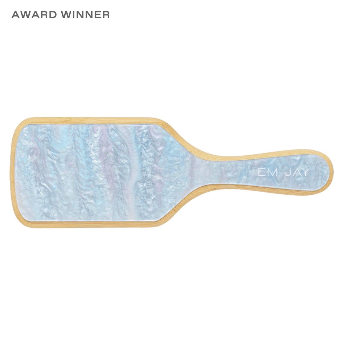 Paddle-shaped hairbrush with blue and purple marbled design, gold trim, and EM JAY branding on handle
