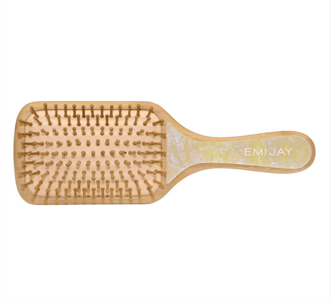 Wooden paddle hairbrush with bamboo bristles and EMI JAY branding on natural wood handle with decorative pattern