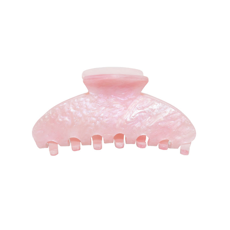 Pink marbled acrylic hair claw clip with teeth grips for securing hair in place