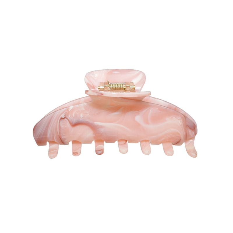 Pink marbled hair claw clip with metal clasp and curved teeth for securing hair