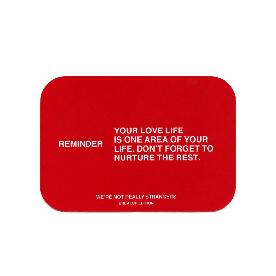 Red rectangular card with white text reading reminder about nurturing all areas of life from We're Not Really Strangers Breakup Edition
