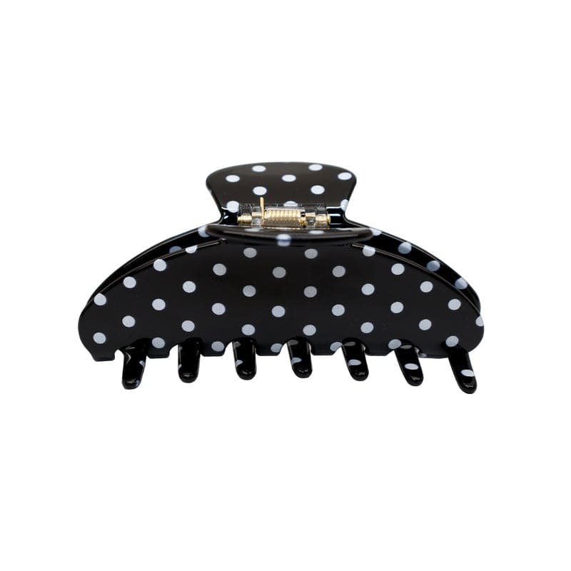 Black polka dot hair claw clip with white dots and metal clasp closure