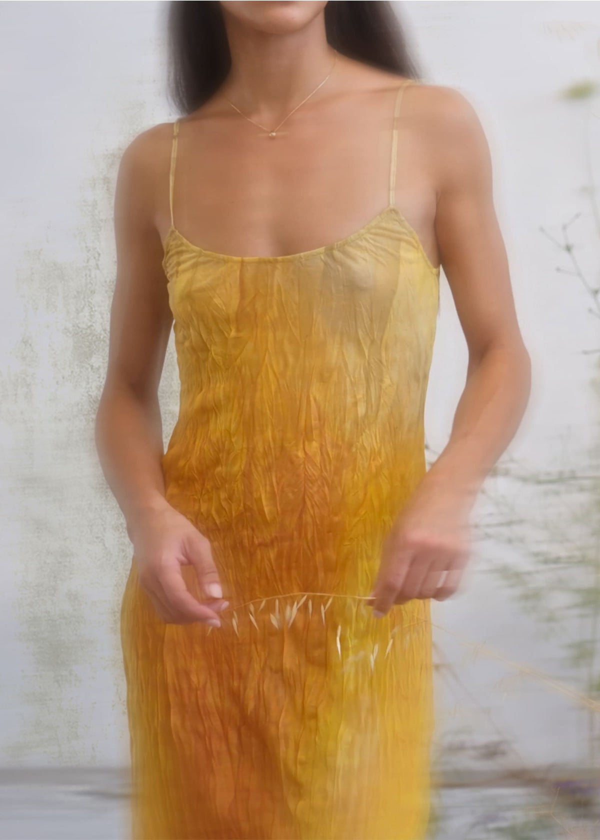 Yellow to amber ombre crinkled silk slip dress with spaghetti straps and scoop neckline.