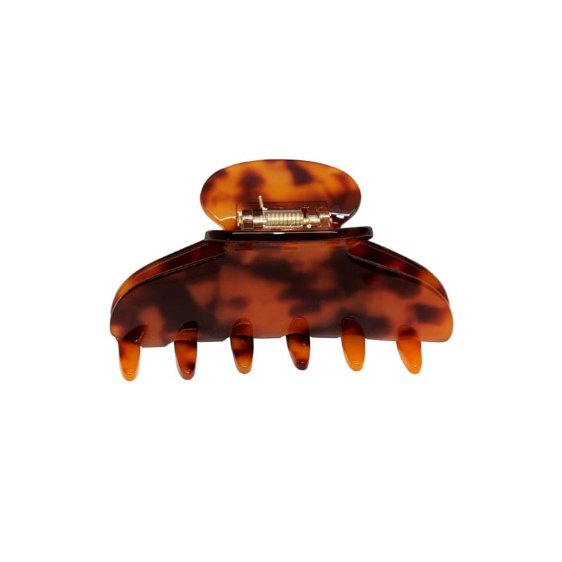 Tortoiseshell brown hair claw clip with metal clasp closure and curved teeth design