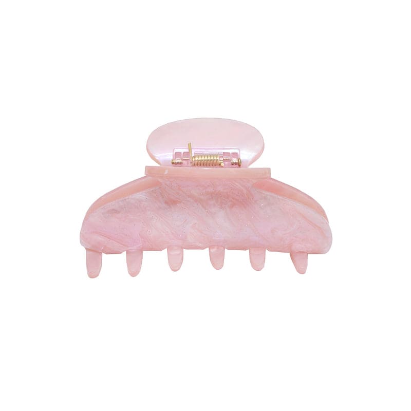 Pink marbled hair claw clip with metal clasp closure and curved teeth design for securing hair
