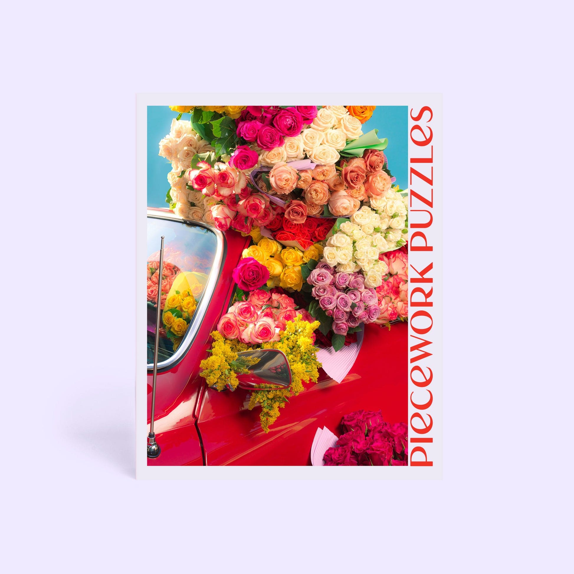 Colorful jigsaw puzzle featuring a vintage red car overflowing with vibrant roses in pink, yellow, white, and orange hues.