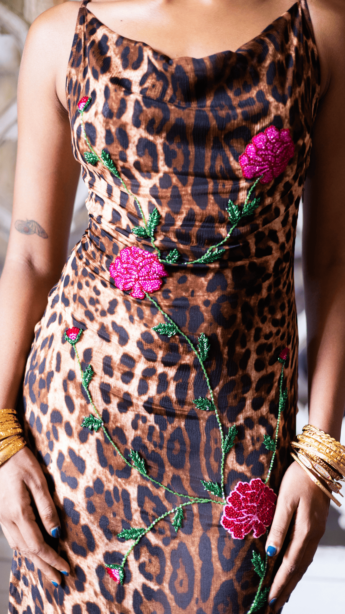 Leopard print slip dress with pink sequin floral embroidery and green leaf details, featuring a cowl neckline