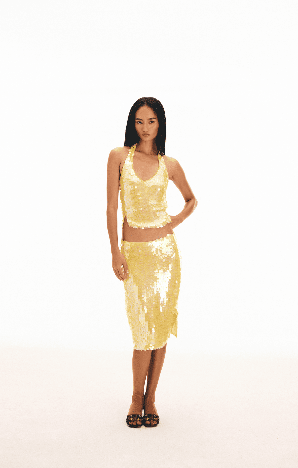 Yellow sequin two-piece set with racerback crop top and knee-length pencil skirt