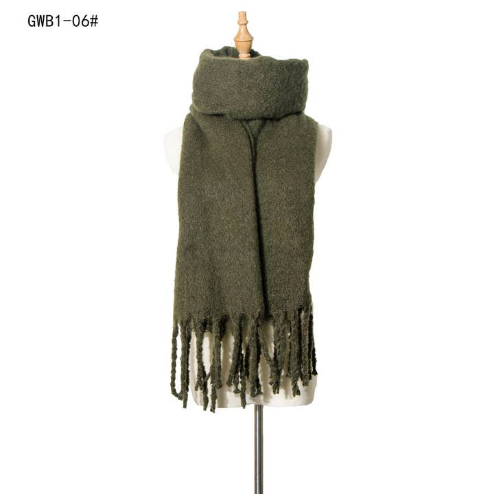 Army green boucle knit scarf with long twisted fringe ends, draped on a mannequin, soft textured fabric