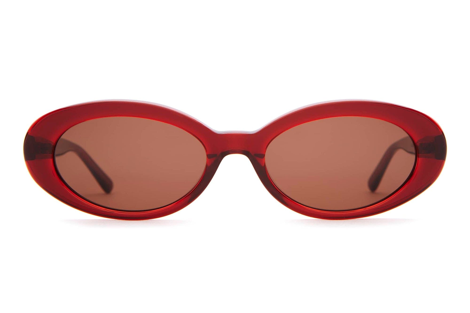 Red oval vintage-style sunglasses with brown tinted lenses and translucent acetate frames on white background