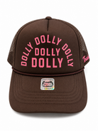 Brown mesh trucker hat with pink "DOLLY DOLLY DOLLY" text on front and Ampal Creative label on brim