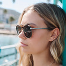 Woman wearing sunglasses with a blurred background