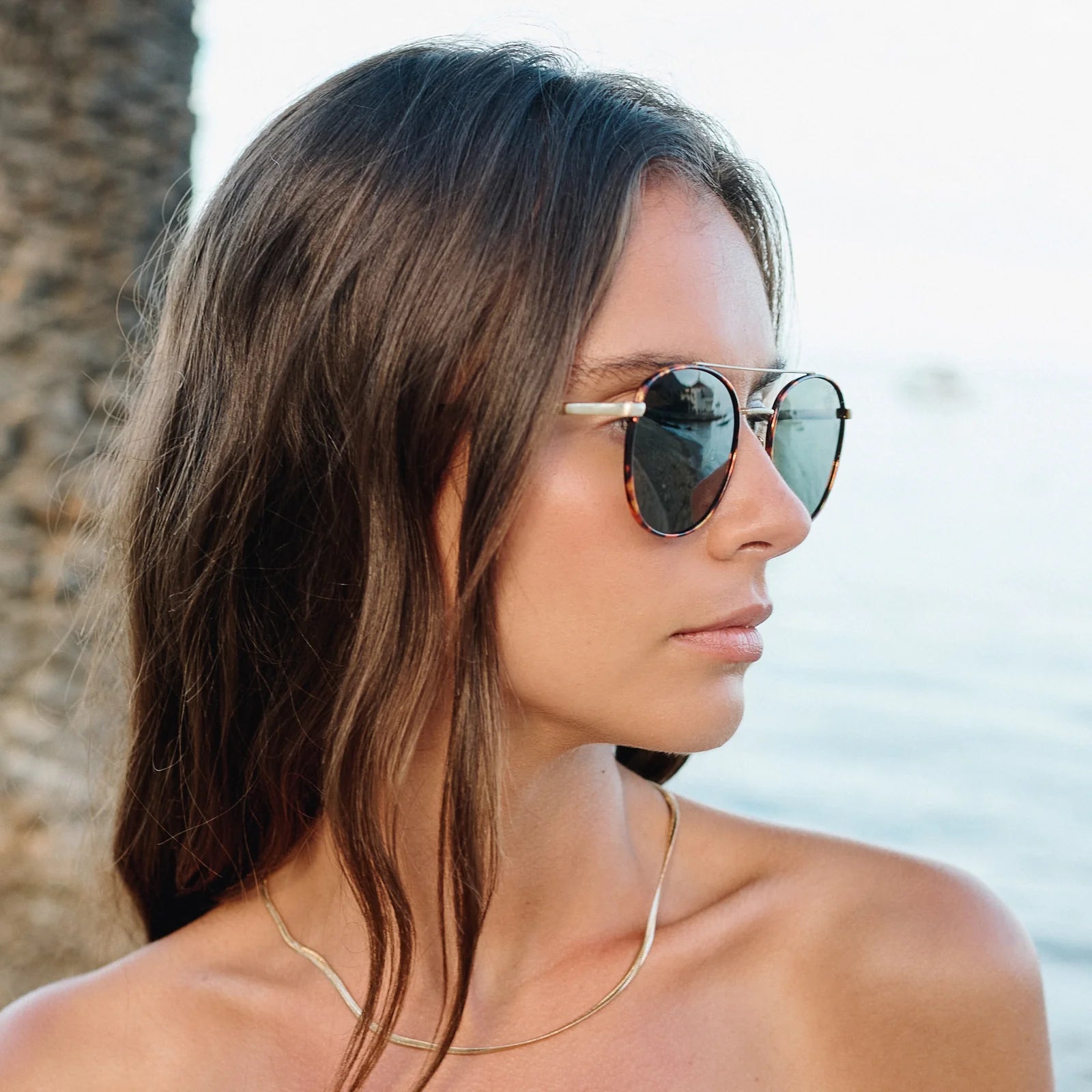 Woman wearing sunglasses with a blurred background