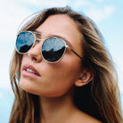 Woman wearing sunglasses with a blurred background