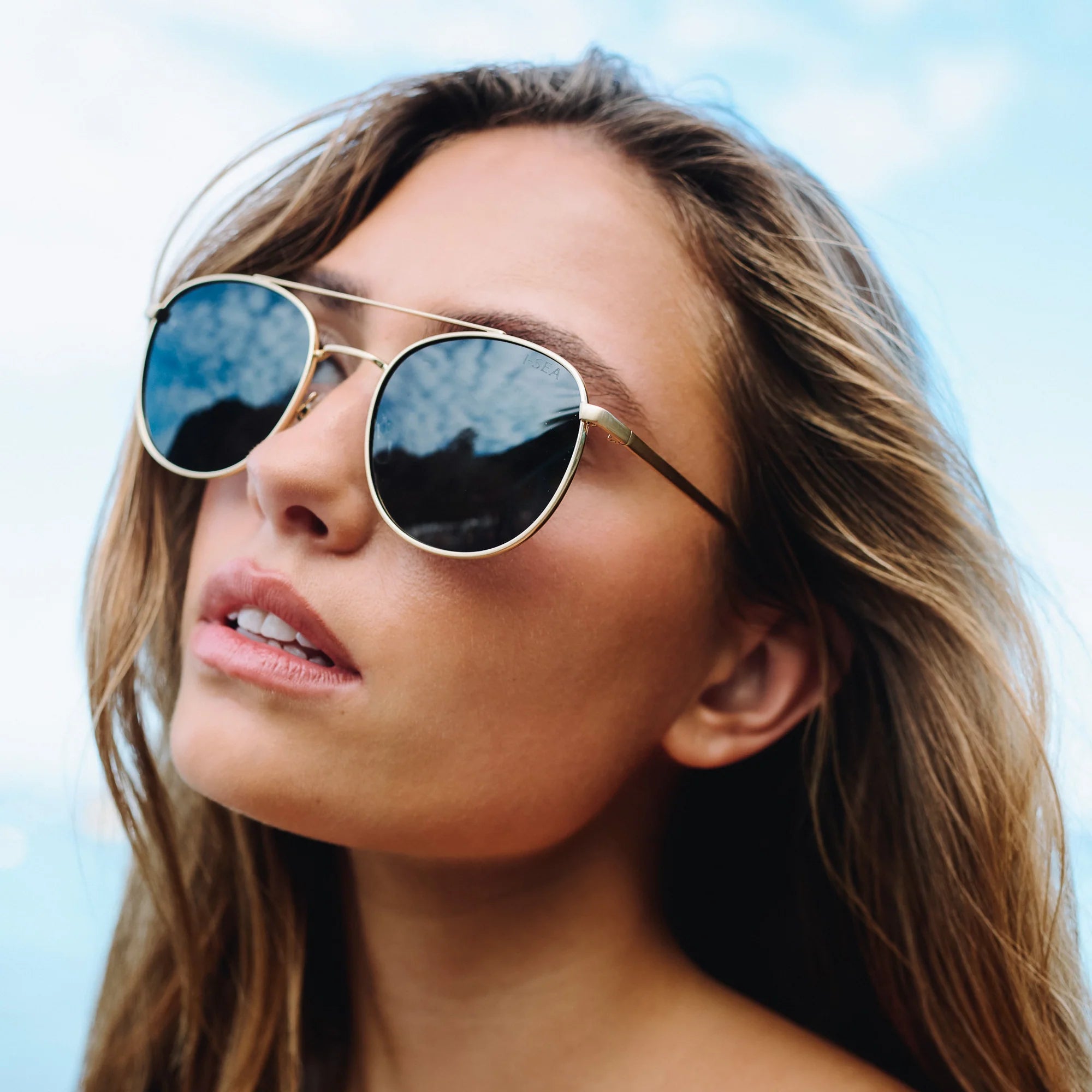Woman wearing sunglasses with a blurred background