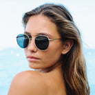 Woman wearing sunglasses with a blurred background