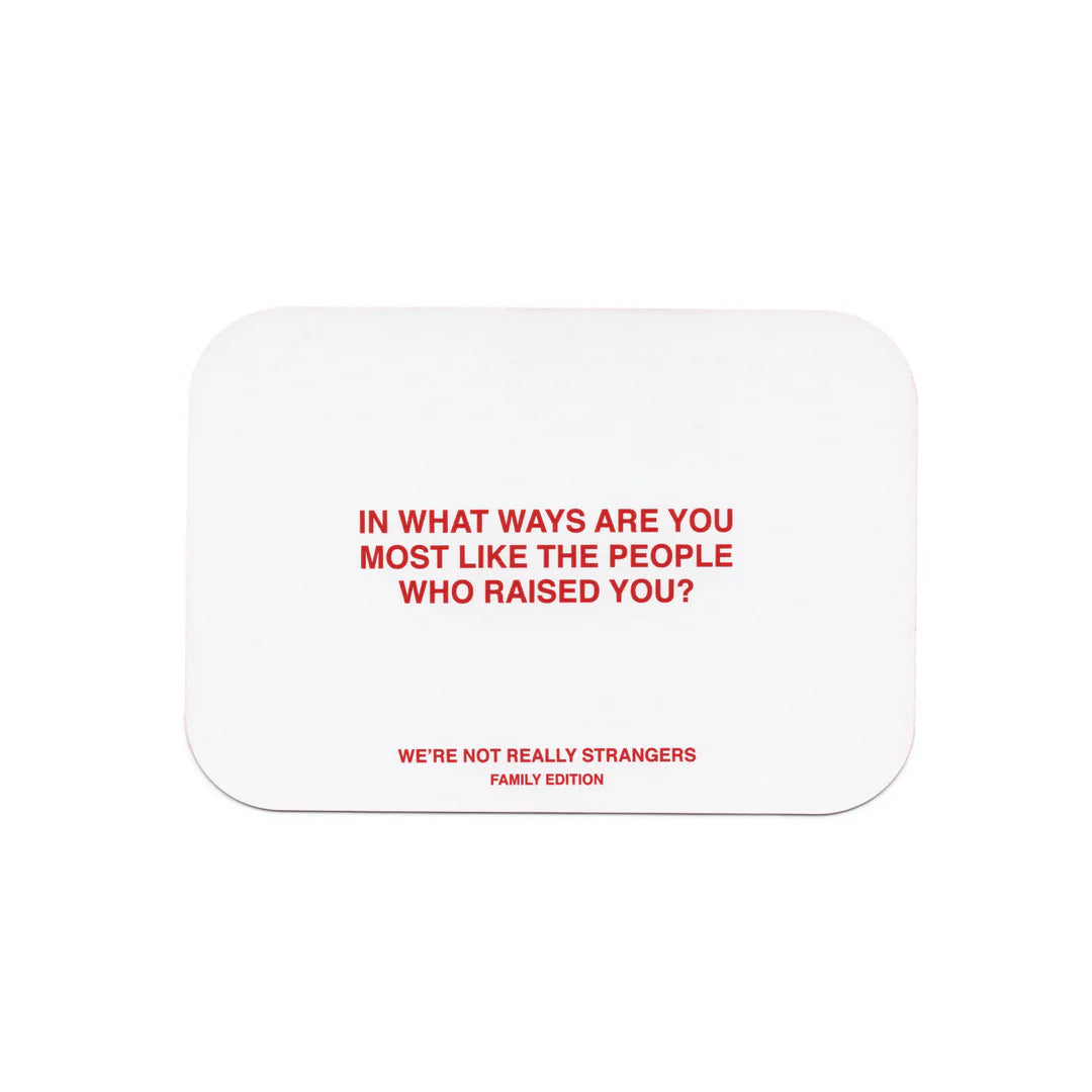 White rounded rectangular card with red text reading question about similarities to people who raised you from family edition game