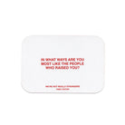 White rounded rectangular card with red text reading question about similarities to people who raised you from family edition game