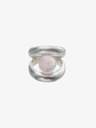 Silver ring with double band design holding a pink rose quartz sphere in the center opening