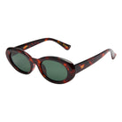 Sunglasses with tortoiseshell frame and dark lenses on a white background
