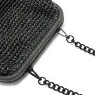 Close-up of a dark gray textured pouch with a chain strap on a white background