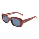 Red sunglasses with blue lenses on a white background