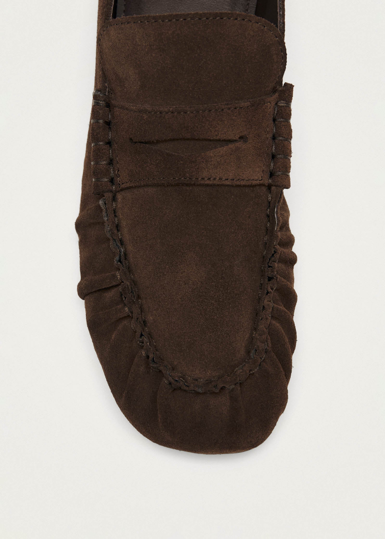 Brown suede driving moccasin with penny loafer strap and hand-stitched detail on toe and sides