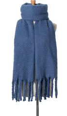 Blue textured knit scarf with fringe tassels displayed on mannequin stand against white background