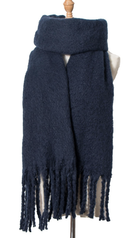 Navy blue knit scarf with fringe tassels displayed on a dress form mannequin
