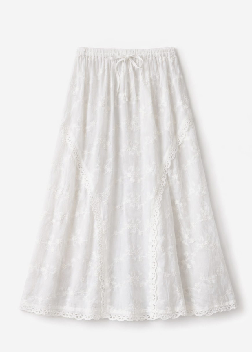 White eyelet lace midi skirt with drawstring waist and scalloped hem on light background