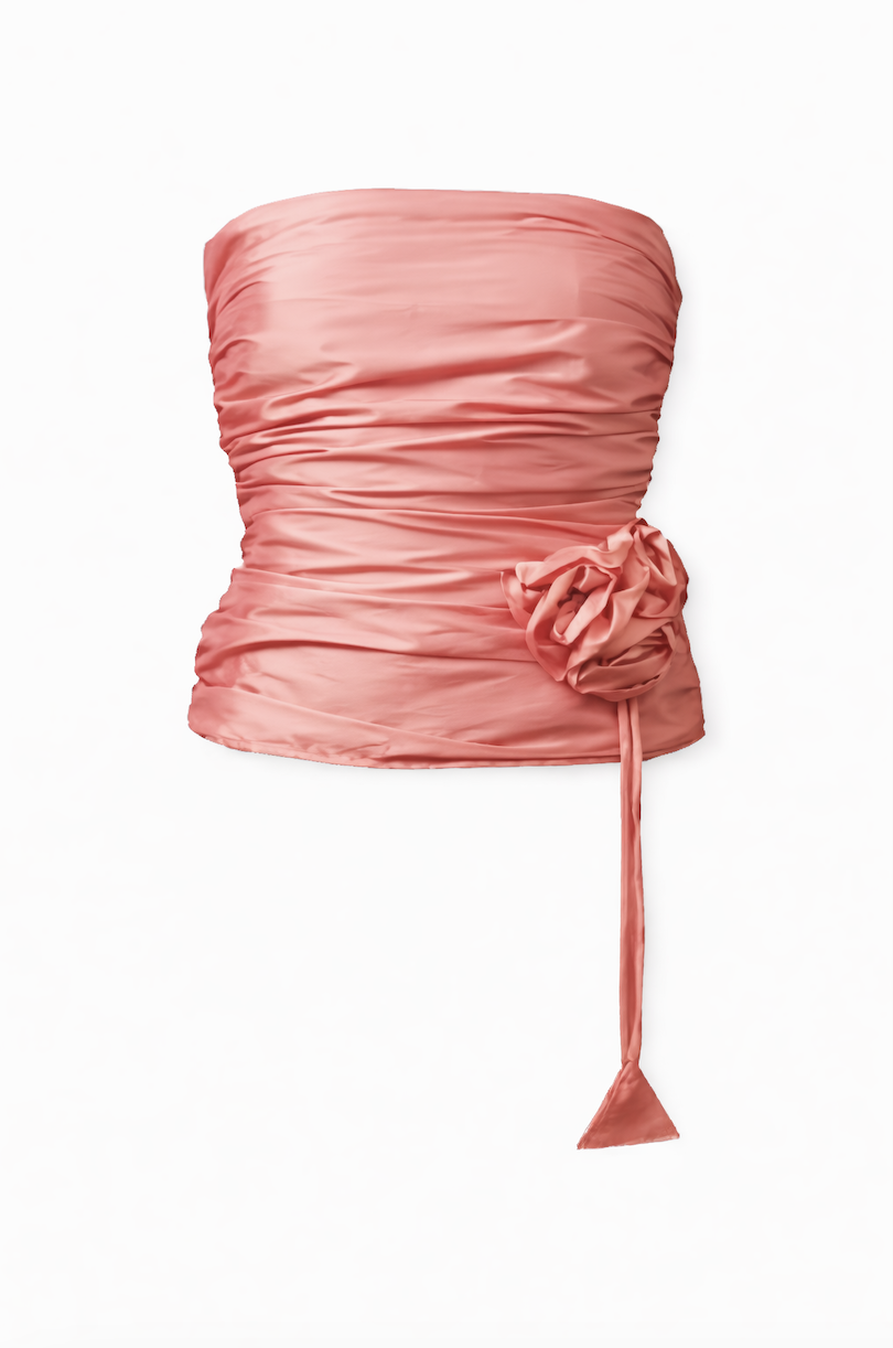 Pink ruched satin strapless top with decorative rosette tie detail at waist