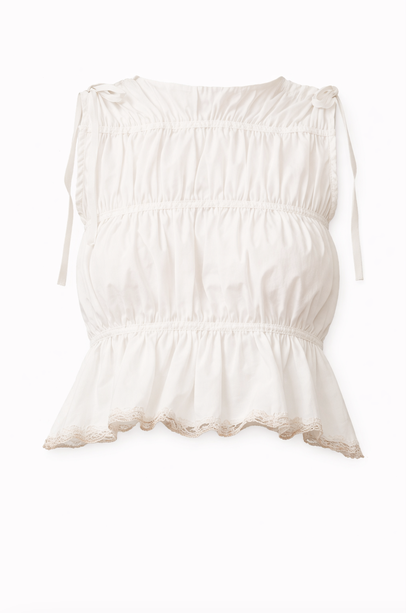 White cotton sleeveless top with ruched elastic details and delicate lace trim along the scalloped hem